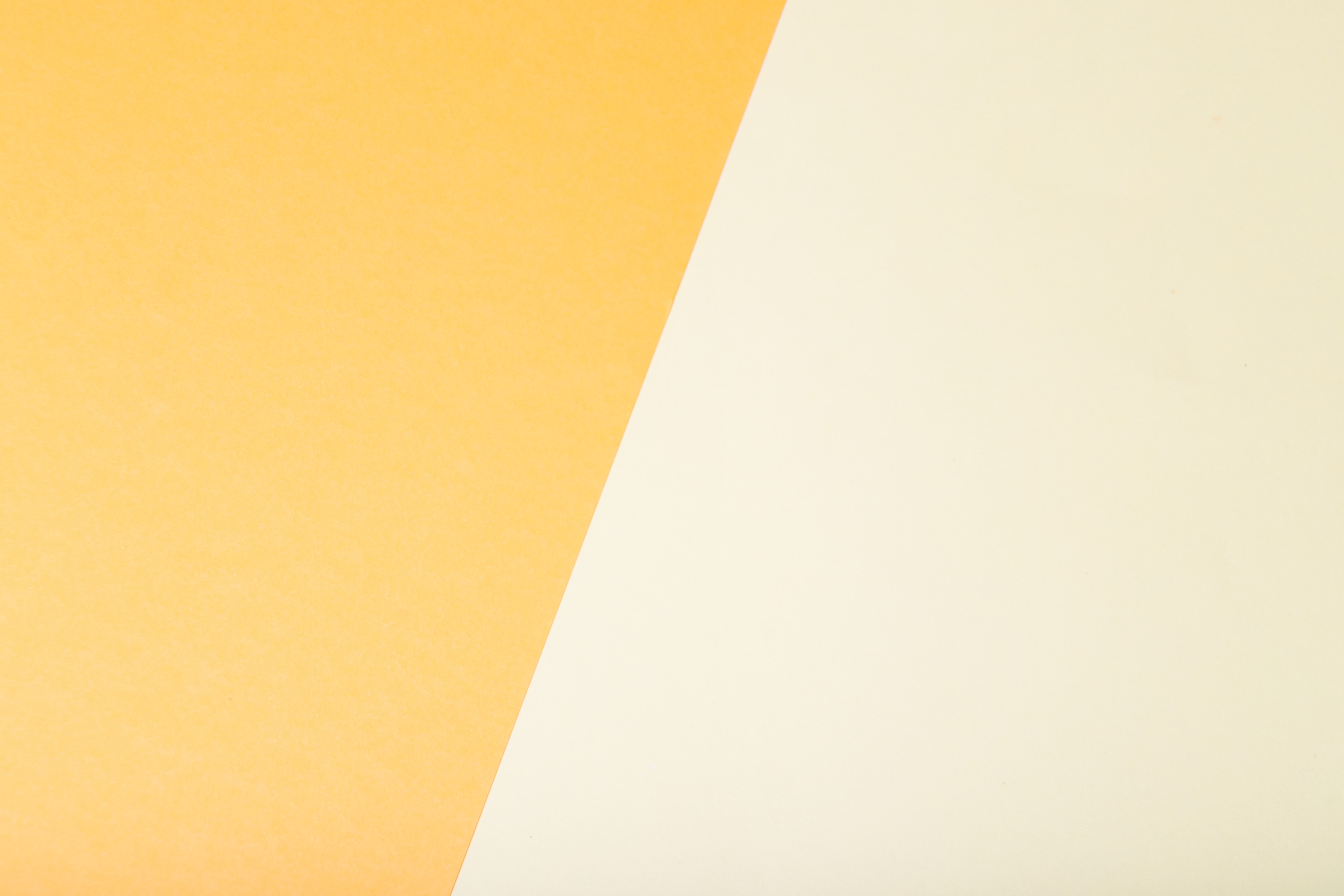 Yellow two tone color paper background.